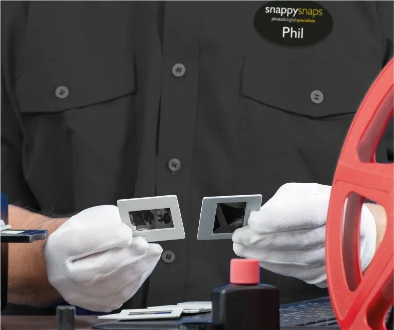 A colleague handling photographic slides and a film reel